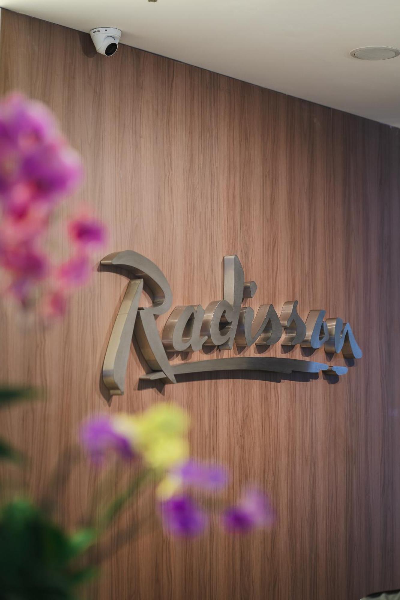 Hotel Radisson Rio De Janeiro Barra Esterno foto The logo of the resort